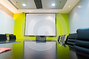 The blank display/projector display in the business meeting room