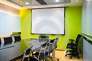 The blank display/projector display in the business meeting room