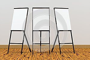 The blank easel board with wooden floor background, 3d rendering