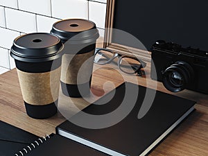 Blank elements on the table with camera, glasses