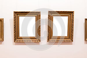 Blank empty frames hanging on museum wall. Art gallery, museum exhibition white clipping path