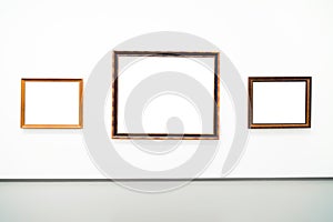 Blank empty golden frame on white background. Art gallery, museum exhibition white clipping path