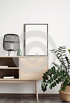 Blank empty picture frame mockup on white wall. Artwork in interior design.