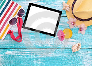 Blank empty tablet computer, summer accessories on