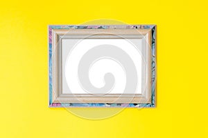 Blank empty vintage wooden frame on yellow background. Art gallery, museum exhibition white clipping path