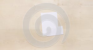 Blank envelope on wood