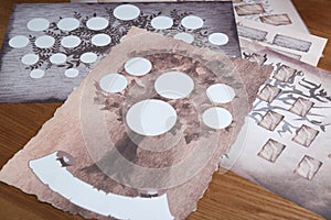 Blank family tree charts on wooden table, closeup