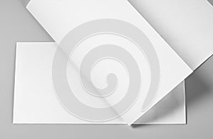 Blank Folded Letterhead, Sheet of Paper, or Flyer over Blank Envelope