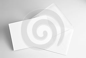 Blank folded white card and envelope