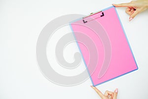Blank Folder with Pink Paper. Hand that Holding Folder and Handle on White Background. Copyspace. Place for Text