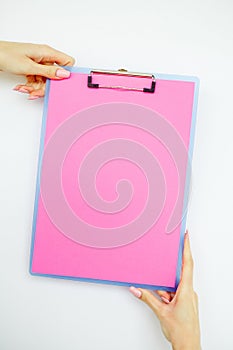 Blank Folder with Pink Paper. Hand that Holding Folder and Handle on White Background. Copyspace. Place for Text