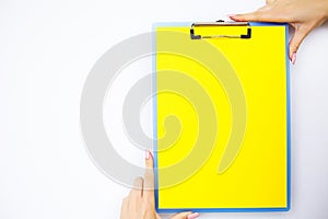 Blank Folder with Yellow Paper. Hand that Holding Folder and Han