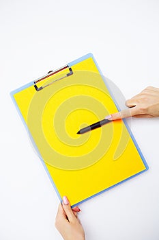 Blank Folder with Yellow Paper. Hand that Holding Folder and Han