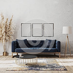 Blank frame mock up on wall in modern living room luxury interior design with dark blue sofa, decorative rug, floor lamp and