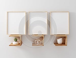 Blank frame mockup hang on wooden floating shelf