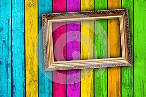 Blank Frame on Multicolored Wood Background