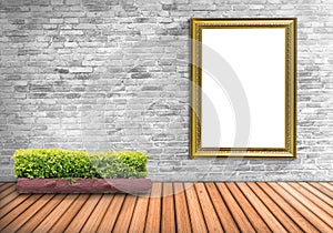 Blank frame vintage on a concrete wall with tree pot on wood flo