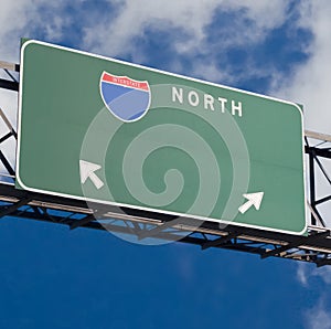 Blank freeway sign in blue cloudy sky