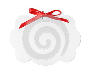 Blank gift tag with satin ribbon on white background