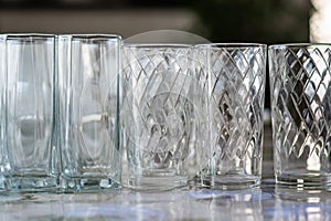 Blank glass wine glasses on display on table against dark background