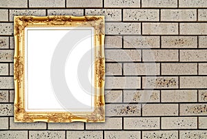 Blank golden frame on brick stone wall