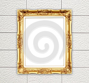 Blank golden frame on brick stone wall