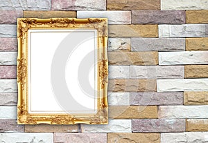 Blank golden frame on brick stone wall