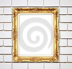 Blank golden frame on brick stone wall