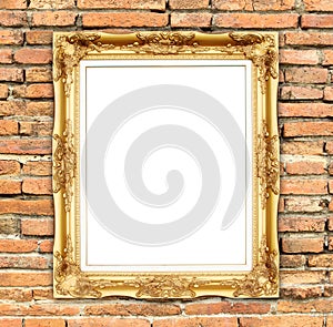 Blank golden frame on brick stone wall