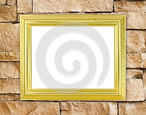 Blank golden frame on brick stone wall