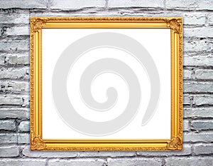 Blank golden frame on brick stone wall