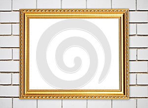 Blank golden frame on brick stone wall