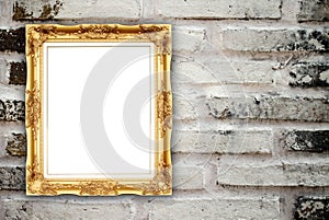 Blank golden frame on brick stone wall