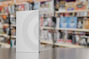 Blank gray hardcover book on bookstore showcase. 3D rendering.