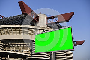 Blank green billboard outside stadium for new advertisement. Ideal for football, soccer, sport related ads.