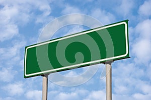 Blank Green Road Sign Against Light Cloudscape Sky