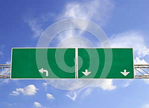 Blank Green Road Sign on Dramatic Blue Sky with Clouds