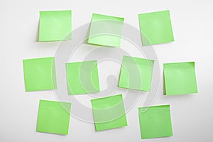 blank green sticky notes mockup on white background. pastel green sticky notes with things to do on office board. Mockup sticky