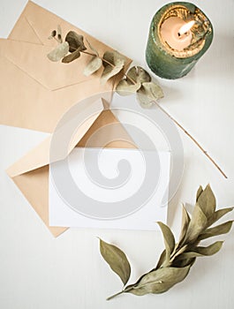 blank greeting card  invitation mockup with craft paper envelope  feminine still life composition