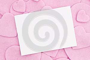 Blank greeting card with lots of pink hearts