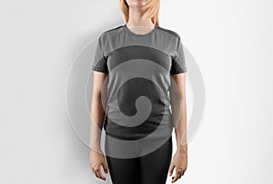 Blank grey t-shirt design mockup. Women stand in gray tshirt