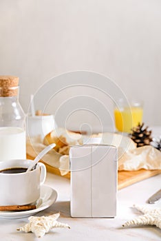 Blank half liter milk box tetra pack  with lid on a table with breakfast. package template, mockup of a retail container for