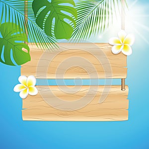 Blank hanging wooden sing with frangipani tropical flowers and sunny sky background with palm leaf
