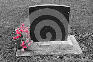 Blank headstone with pink flowers