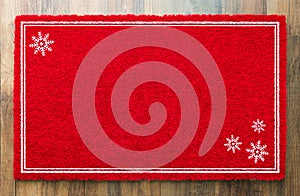Blank Holiday Red Welcome Mat With Snow Flakes On Wood Floor Background