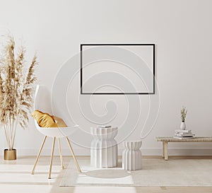Blank horizontal picture frame mock up in modern interior background with empty white wall, chair and pampas grass, luxury living
