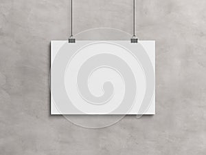 Blank horizontal poster hanging with clips on a concrete wall Mockup. 3D rendering