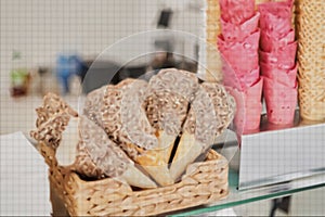 blank ice cream wafers. Waffle cones in an ice-cream shop, Italy. A variety of sugar-free vegan ice cream with natural