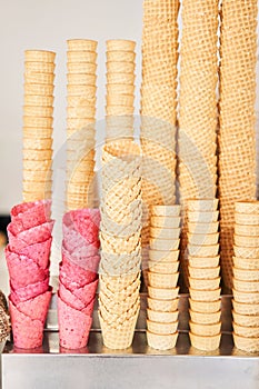 blank ice cream wafers. Waffle cones in an ice-cream shop, Italy. A variety of sugar-free vegan ice cream with natural