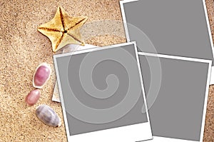 Blank instant photos frames on sand and seashells